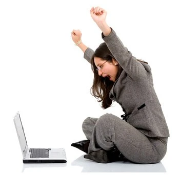 A woman sits on the floor celebrating getting one of 2xx success codes on her open laptop screen.