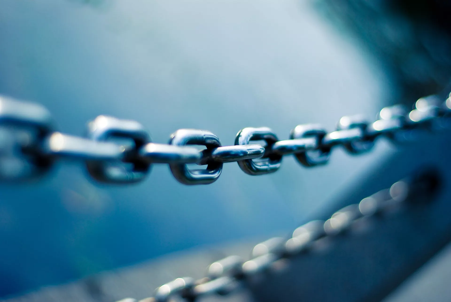 A close-up image of a chain, emphasizing its intricate link structure.
