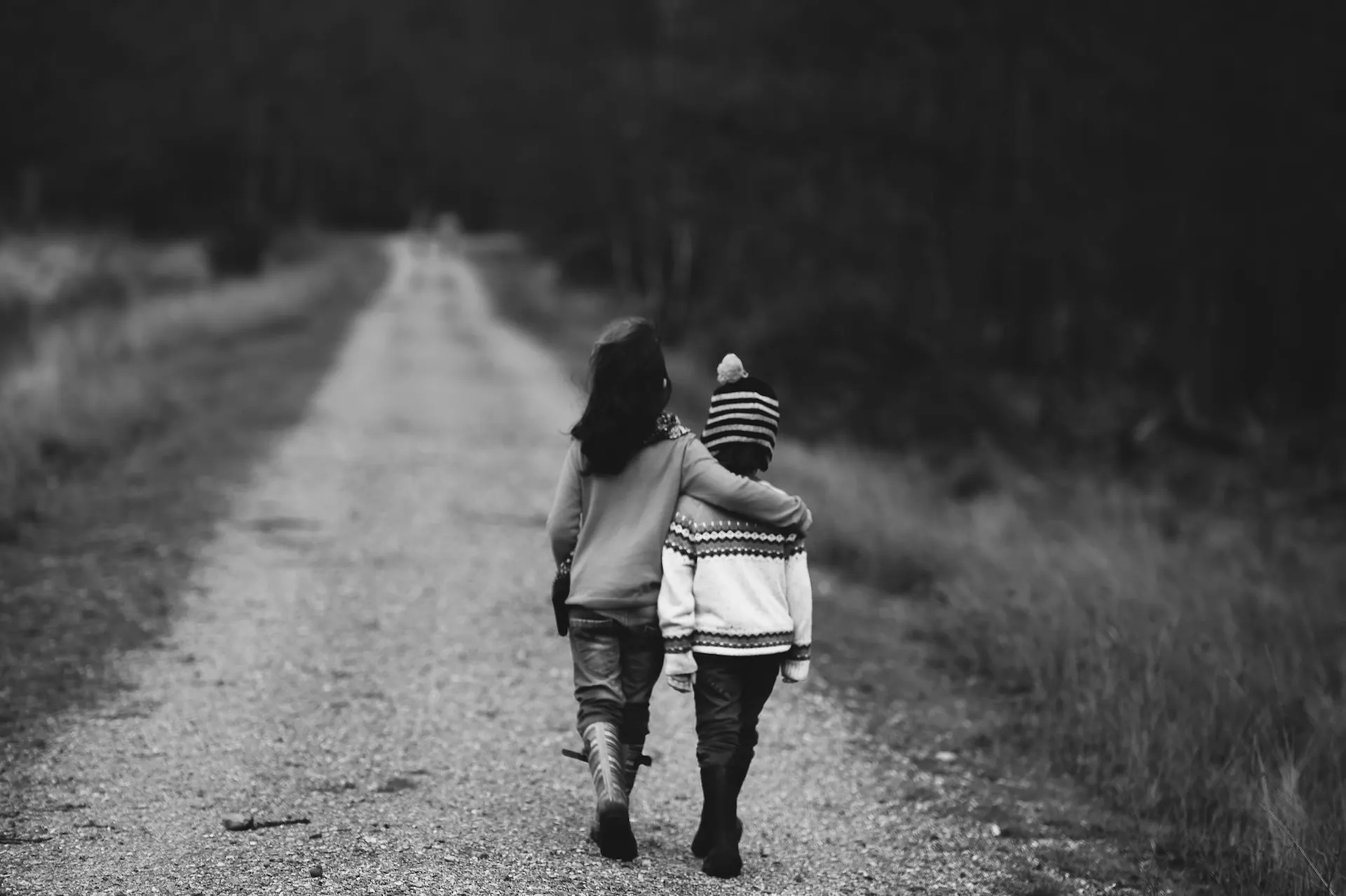 Two children walking down a dirt road in black and white, emphasizing the relationship between SEO and design.